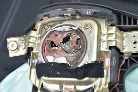 ruptured takata airbag inflator with fractured metal housing